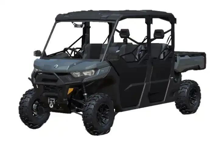 Six-seat Can-Am Defender MAX with cargo bed in dark gray, front three-quarter view on white