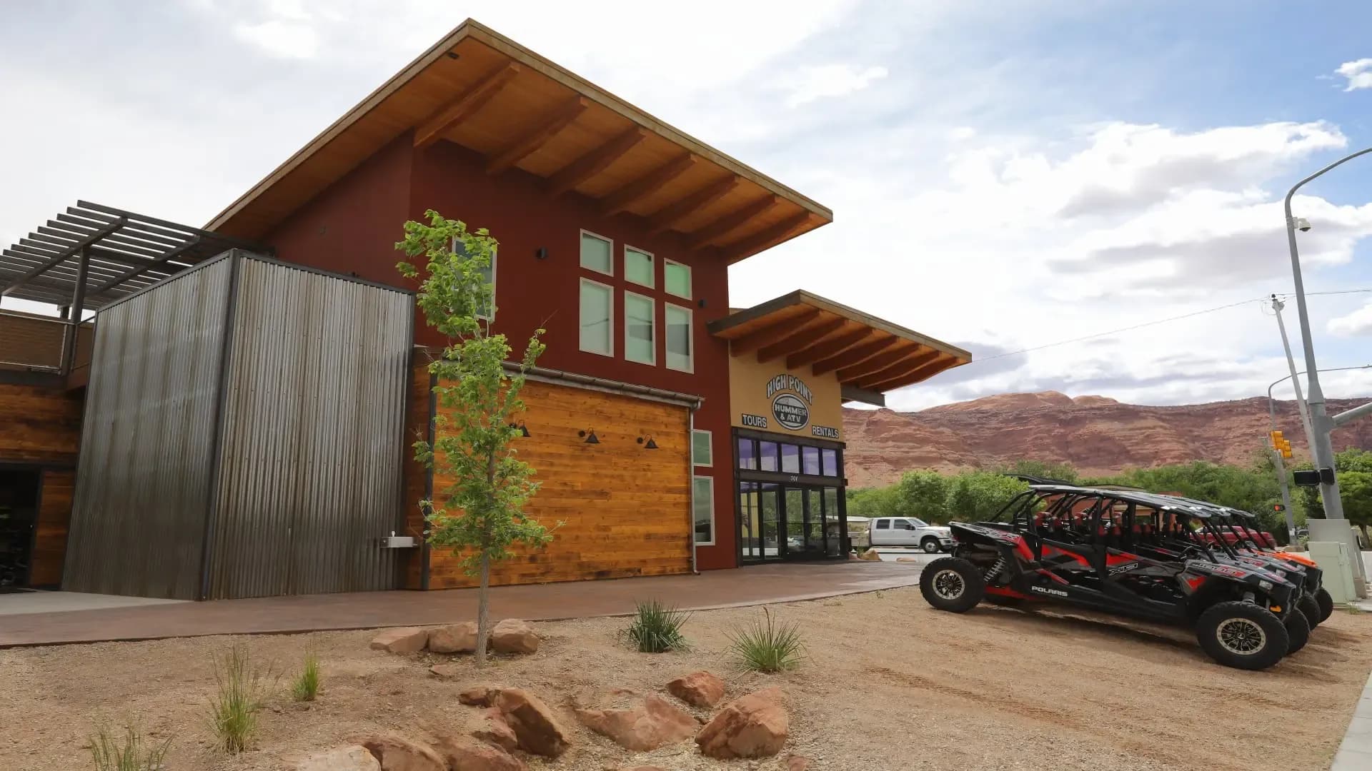 Exterior of the High Point Hummer & ATV building with a row of Can-Am UTVs parked outside