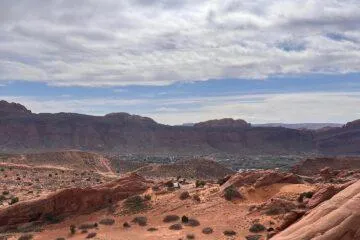 Wide view over Moab's red-rock valley from high on the slickrock